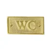 WC-skylt - Mässing